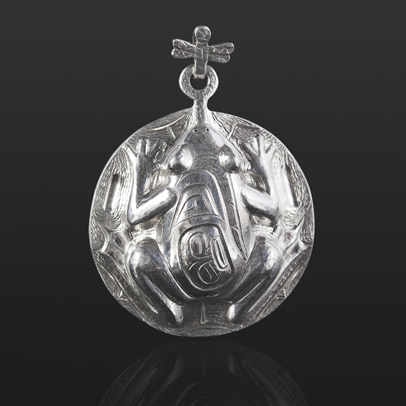 the catch pendant dragonfly frog Gus Cook Kwakwaka'wakw silver Repoussé jewelry pendant native art northwest coast 2 x 1 1/2 1400