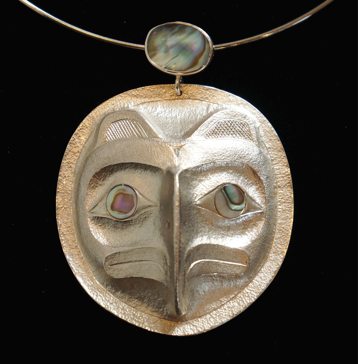 Eagle Chief's Frontlet Pendant Rande Cook Kwakwaka'wakw repousse sterling silver, abalone 2.5"H x 2.25"W x .75"D