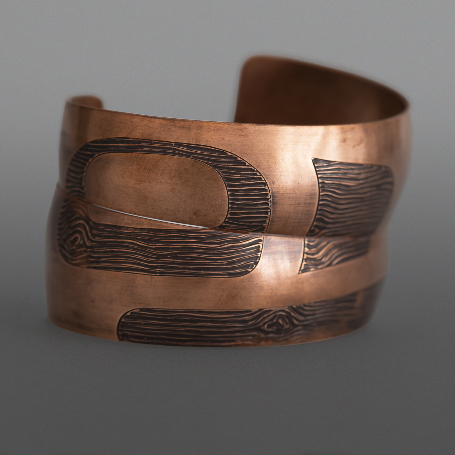 'Raven Ties' Wood Grain Pattern Bracelet SetJennifer Younger
TlingitHeat-patina copper
1” tapering to ½” x 6" each$650