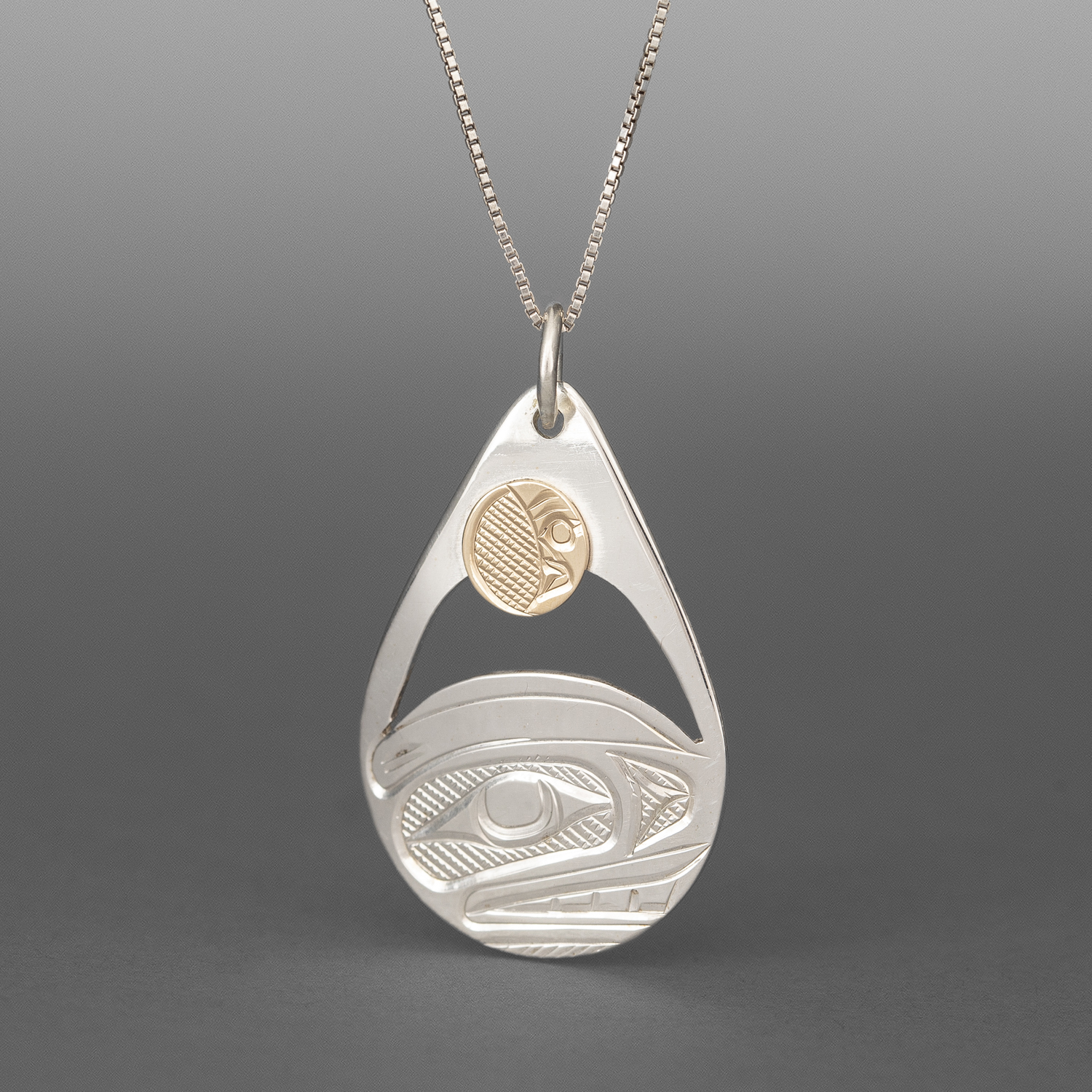 Orca & MoonPendant
Corrine Hunt
Kwakwaka'wakw/Tlingit
Sterling silver, 14k gold
1½” x 1"
$325