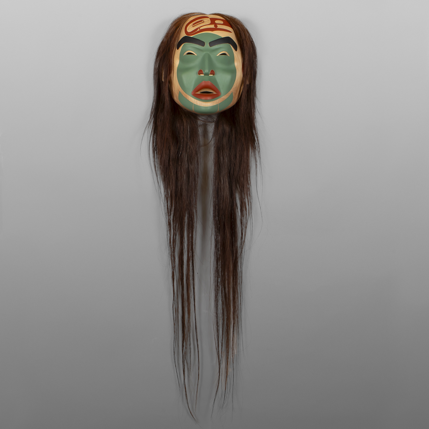 SNG_251028_081 Txaamsm - The Raven
Shawn Aster
Tsimshian
Alder, horsehair, paint
11" x 11” x 6"
(50" with hair)
5,800
