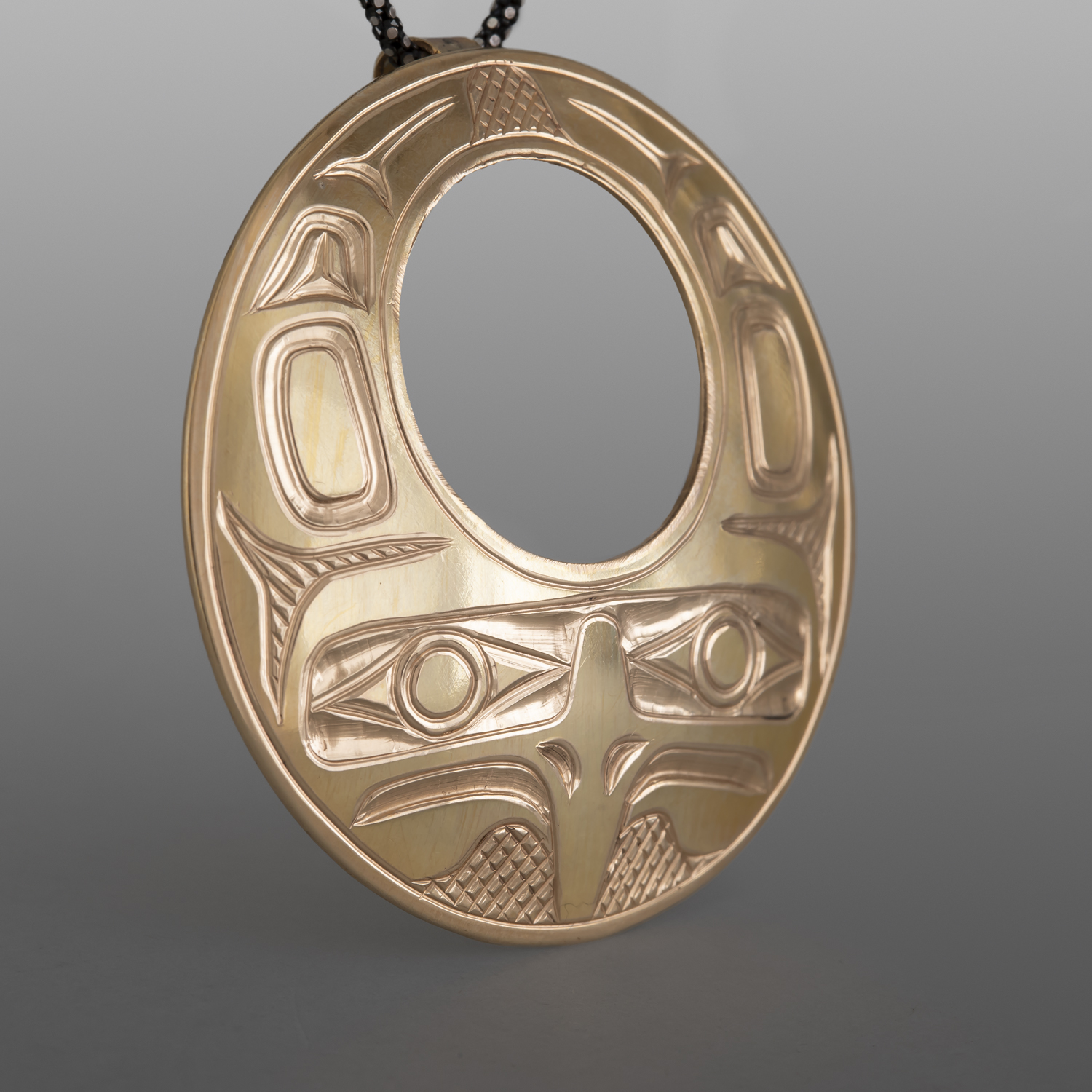 Eagle in Flight Pendant
William Bedard
Haida
14k gold
1¾" dia.
2,800