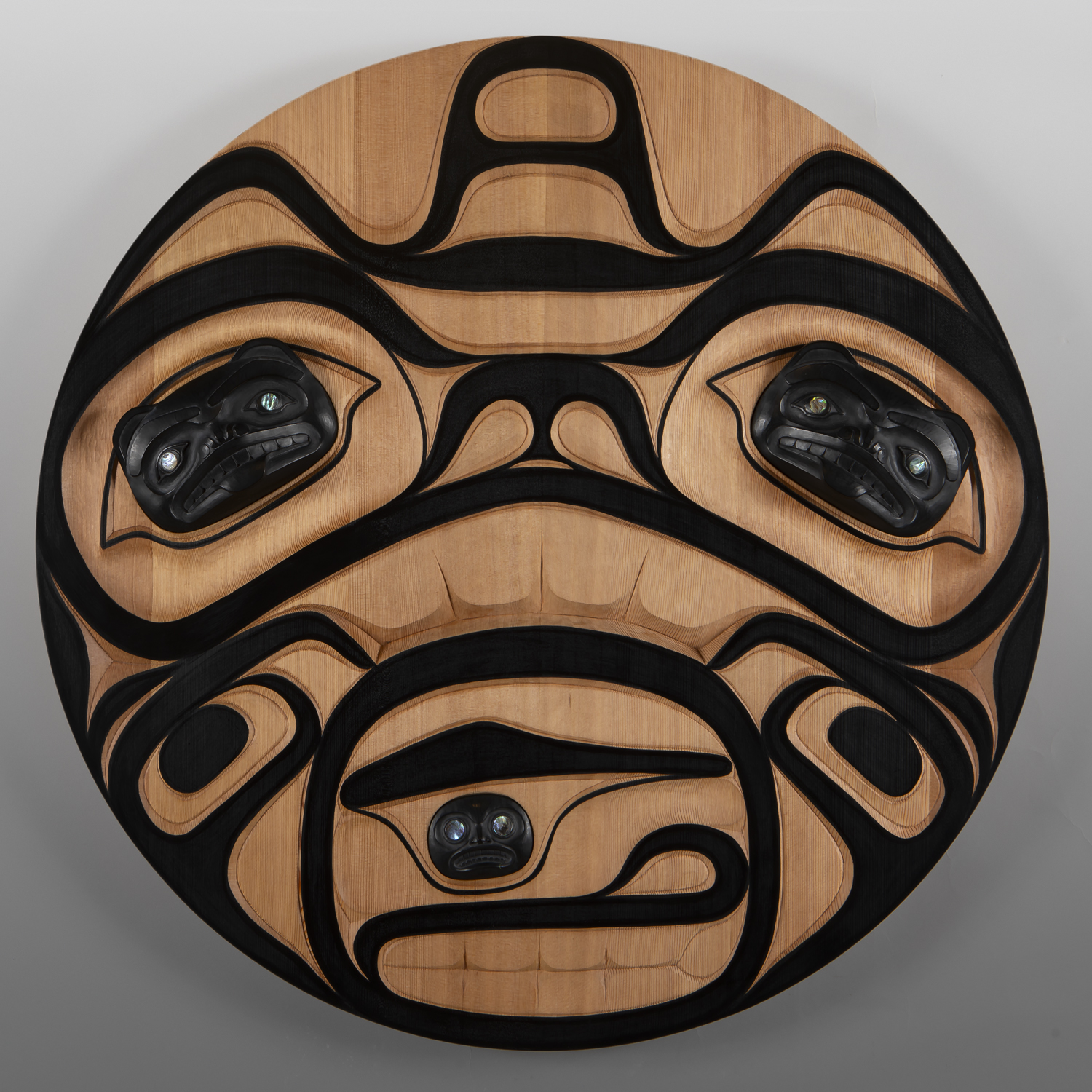 Haida Bear
Mason Menzies
Haida
Red cedar, argillite powder resin, abalone, paint
36" dia. x 3"
$3400
