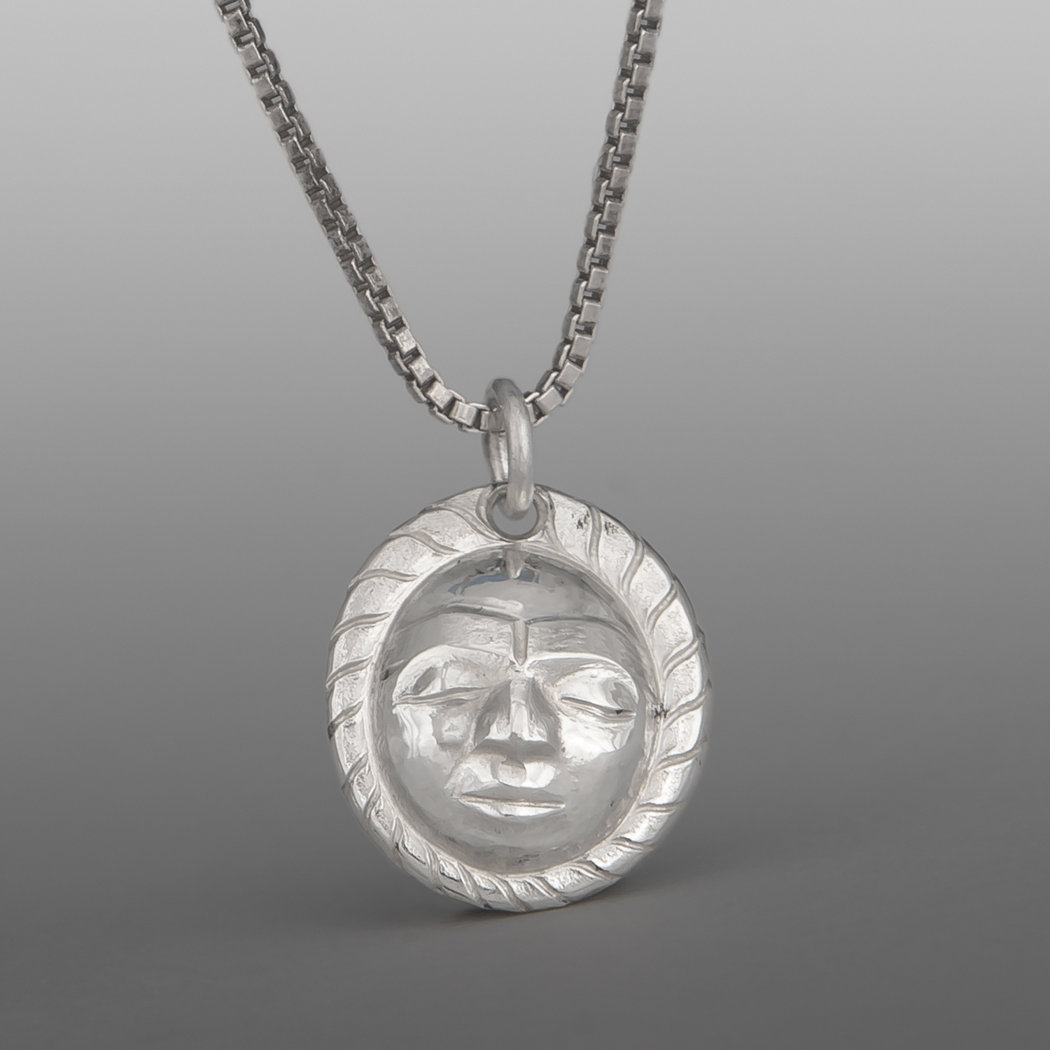 Maskette Pendant
Gus Cook
Kwakwaka'wakw
Repoussé silver
⅝" x ½"
$450