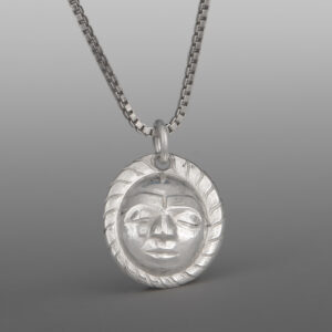 Maskette Pendant
Gus Cook
Kwakwaka'wakw
Repoussé silver
⅝" x ½"
$450