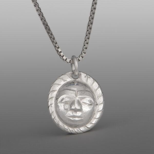 Maskette Pendant
Gus Cook
Kwakwaka'wakw
Repoussé silver
⅝" x ½"
$450