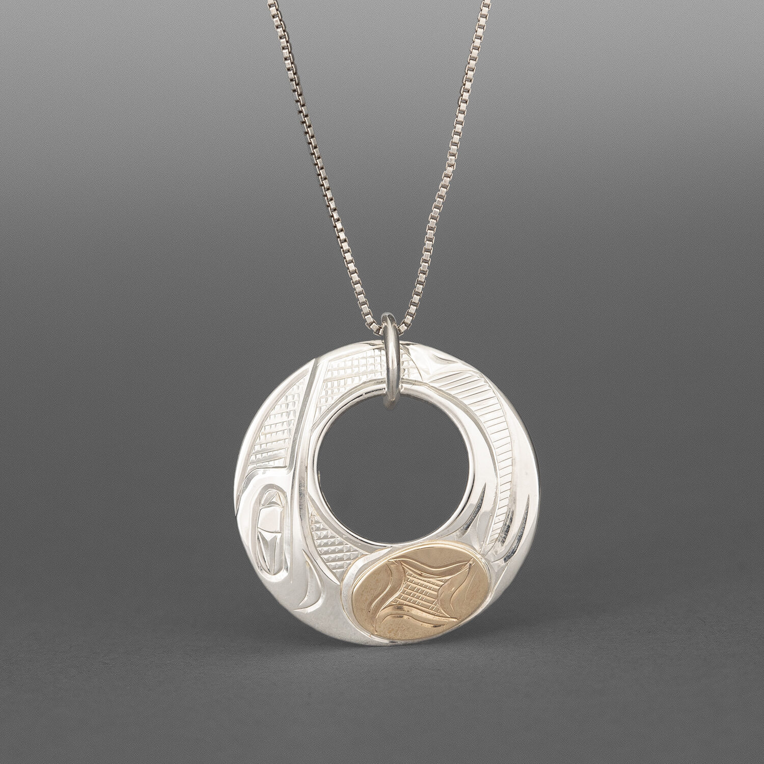 Hummingbird Pendant
Corrine Hunt
Kwakwaka'wakw/Tlingit
Sterling silver, 14k gold
1" dia.
$295