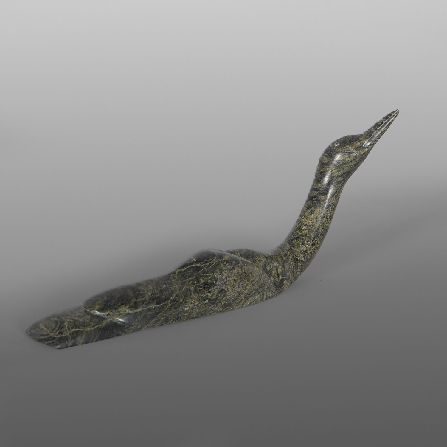 Gliding Loon
Ningeosiaq Ashoona
Inuit
Serpentine
12" x 5¼" x 2¼"
1,600