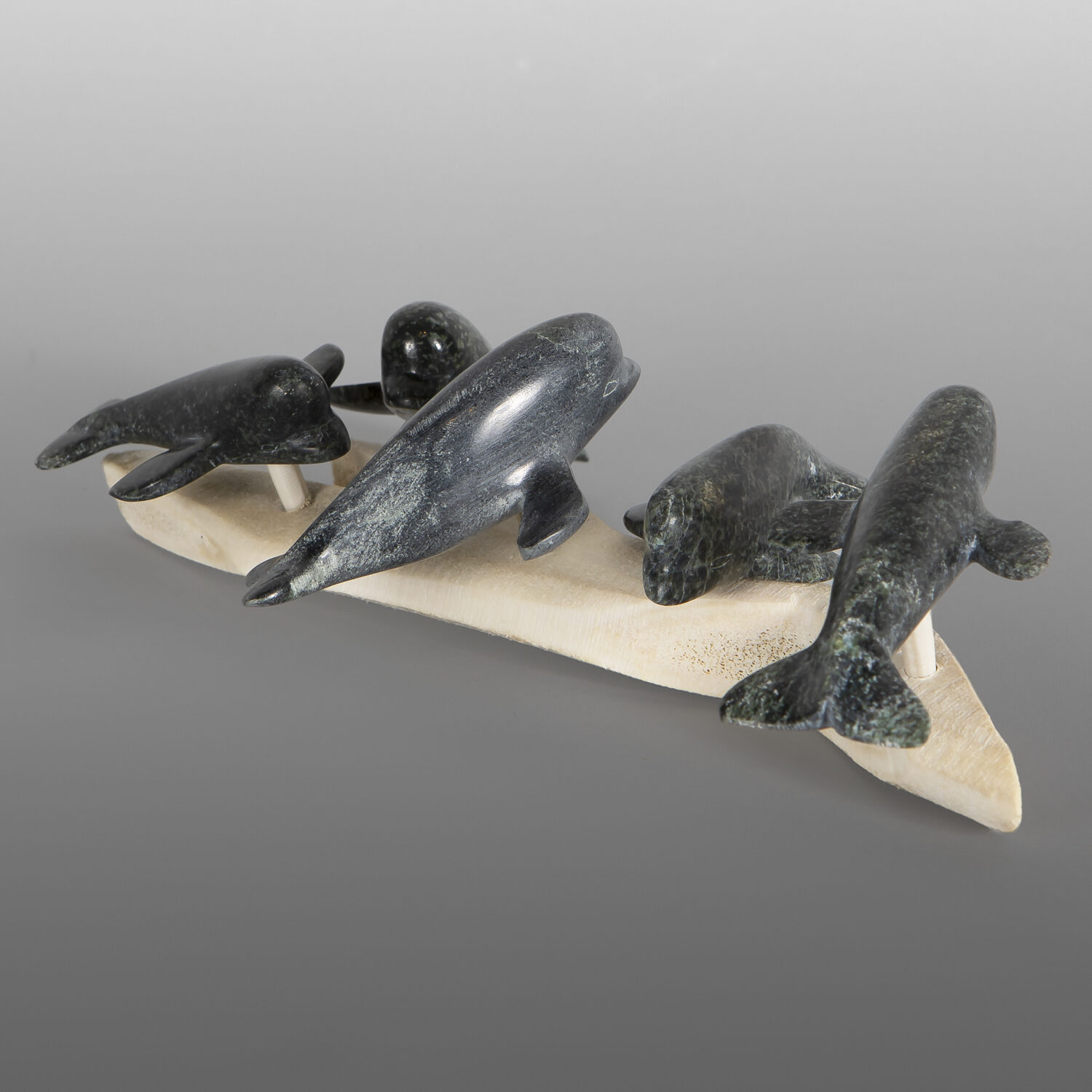 Beluga Pod
Isa Oqutaq
Inuit
Serpentine, antler
8¼" x 4¾" x 2¼"
900