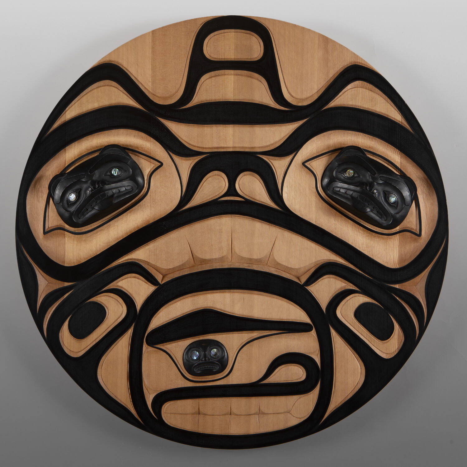 Haida Bear
Mason Menzies
Haida
Red cedar, argillite powder resin, abalone, paint
36" dia. x 3"
$3400